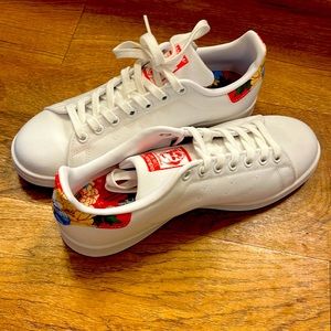 Adidas Stan Smith white canvas shoes with a touch of floral print